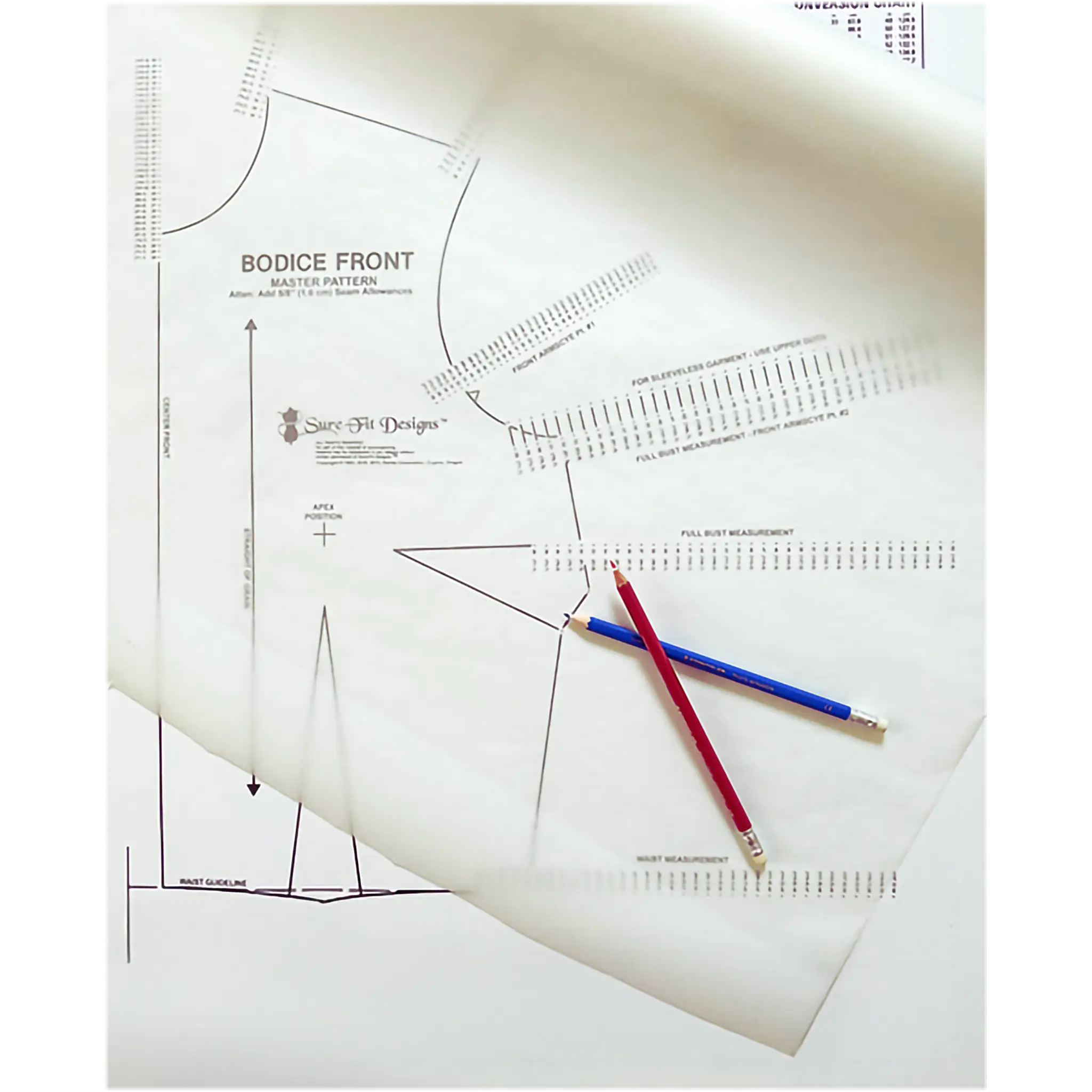 A close-up of sewing pattern paper with printed bodice front measurements and guides, overlaid with two pencils, one red and one blue.